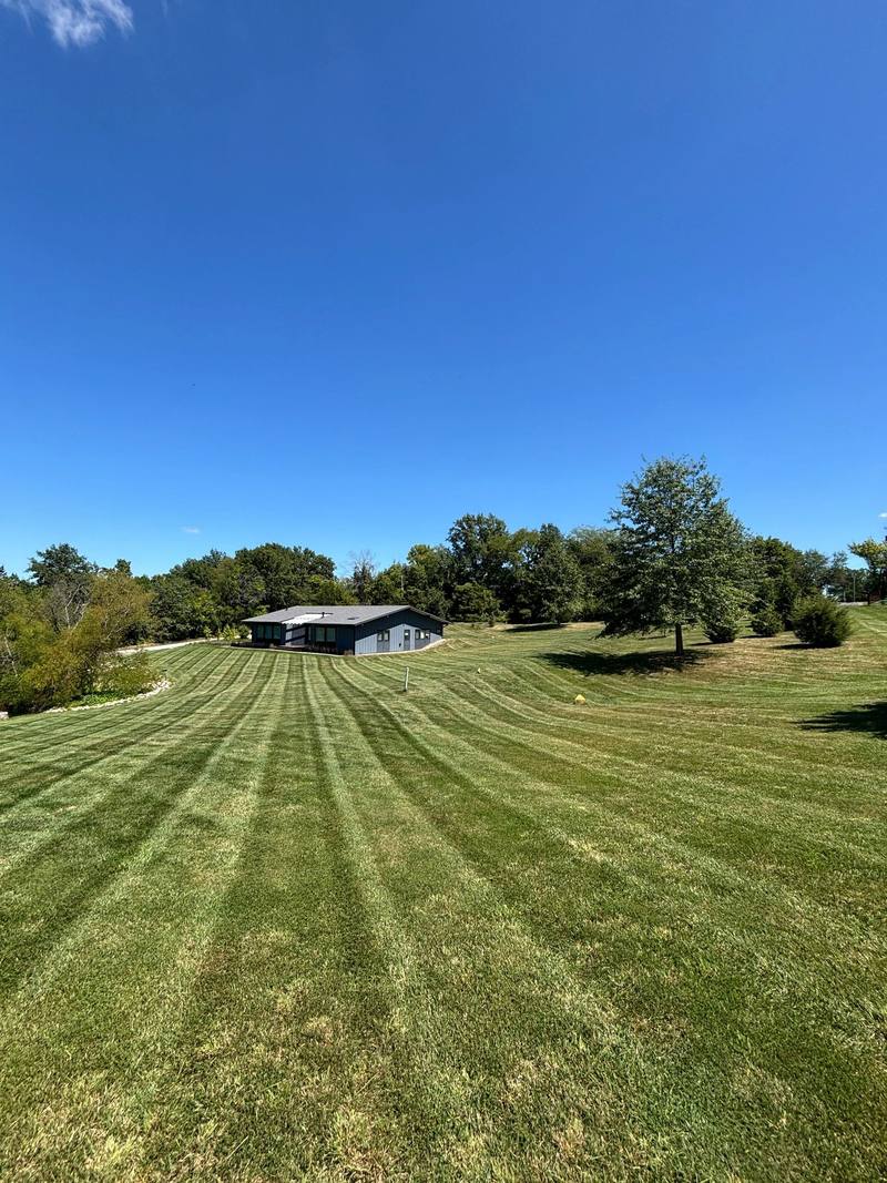 Striped lawn mowed by Stewart's Seasonal Services