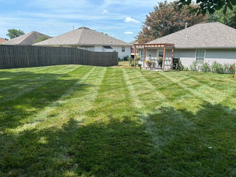 Striped lawn mowed by Stewart's Seasonal Services