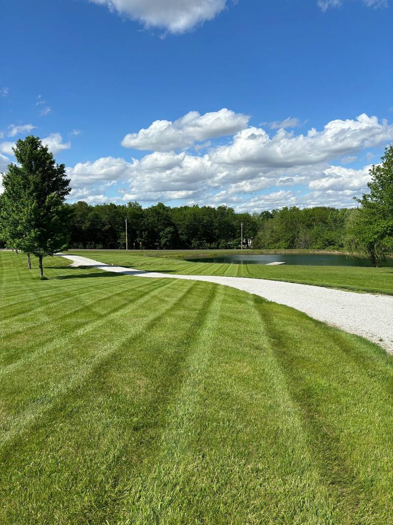 Striped lawn mowed by Stewart's Seasonal Services